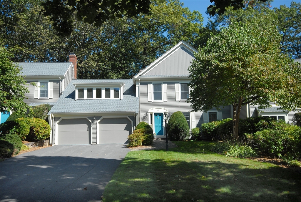 12 South Meadow Ridge, Unit 12 Concord, MA 01742 - Photo 38 of 38 a front view of a house with a garden