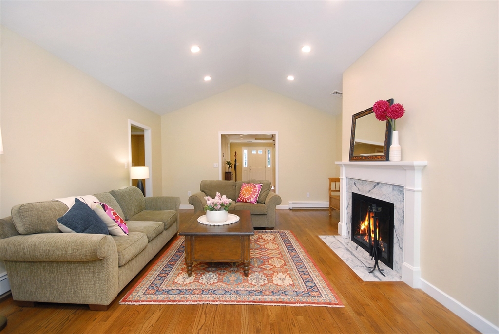 12 South Meadow Ridge, Unit 12 Concord, MA 01742 - Photo 7 of 38 a living room with furniture and a fireplace