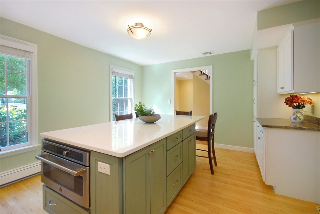 12 South Meadow Ridge, Unit 12 Concord, MA 01742 - Photo 10 of 38 a room with a table chairs and wooden floor