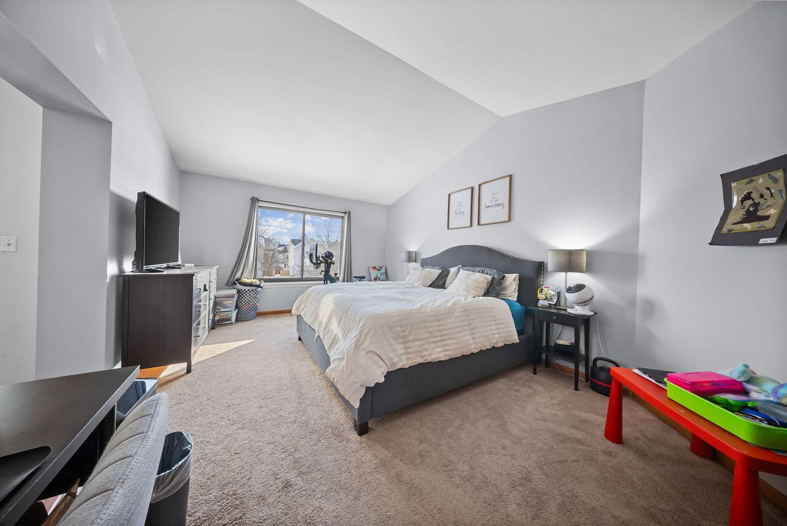 1960 Tuscany Lane Romeoville, IL 60446 - Photo 17 of 24 a spacious bedroom with a bed and a flat screen tv