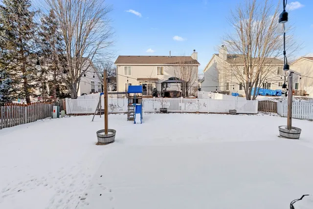a view of a house with a snow on the road