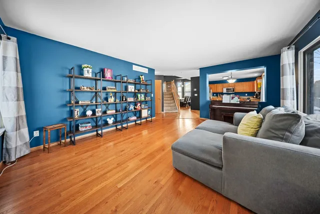 a living room with fireplace furniture and a flat screen tv