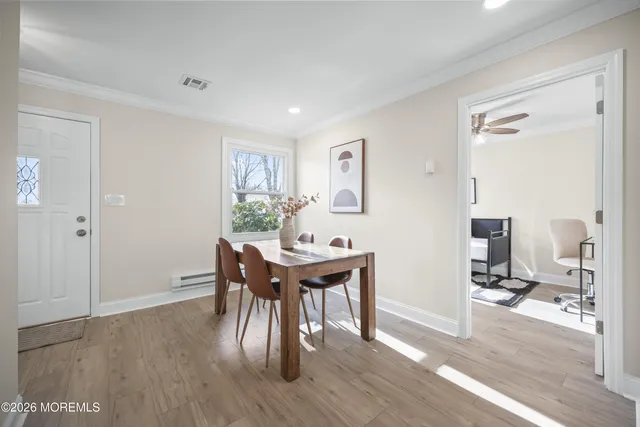 a view of a dining table and chairs in a room