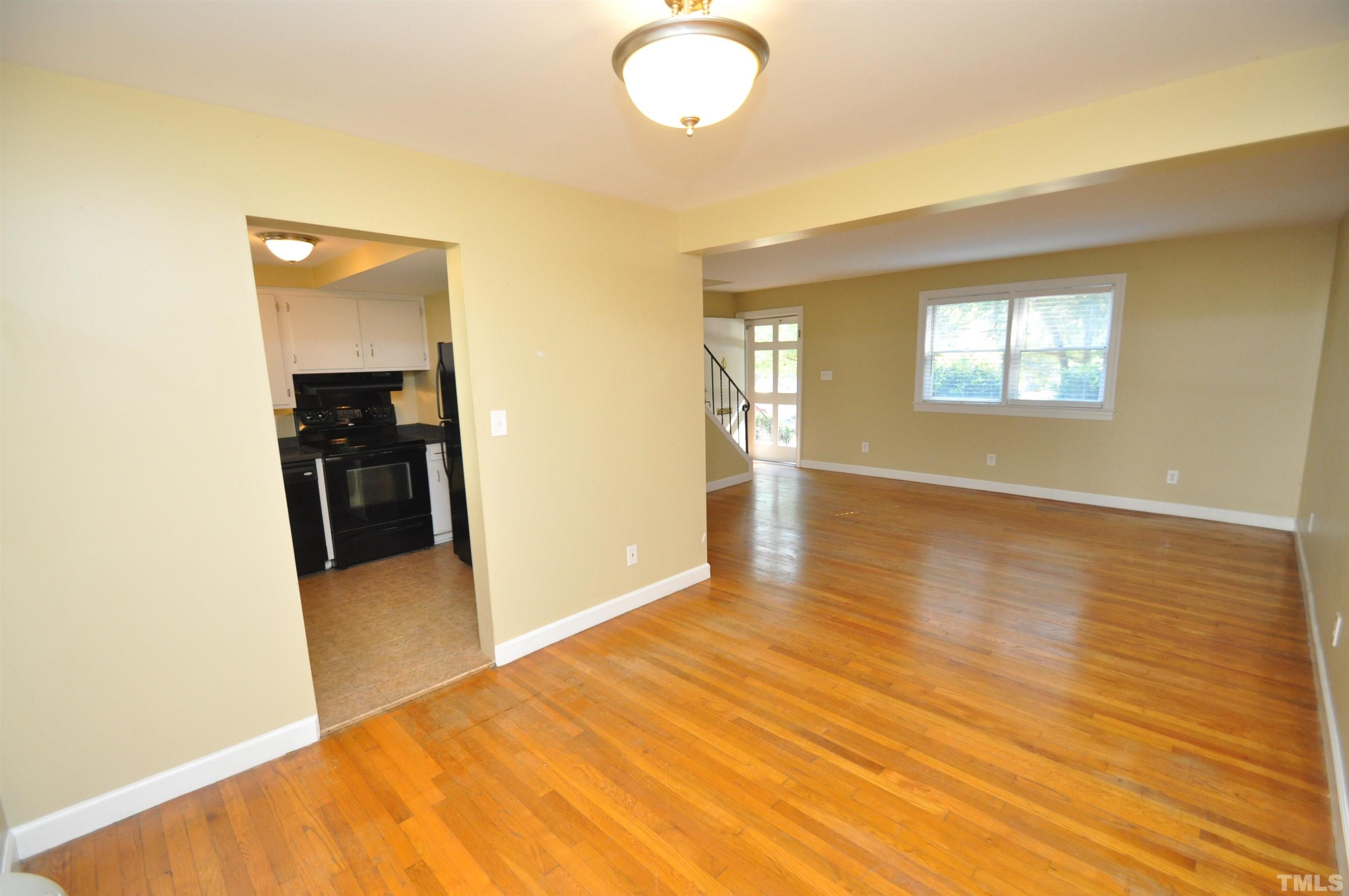 1603 Sutton Drive, Unit 2 Raleigh, NC 27605 - Photo 6 of 22 a view of a livingroom with wooden floor