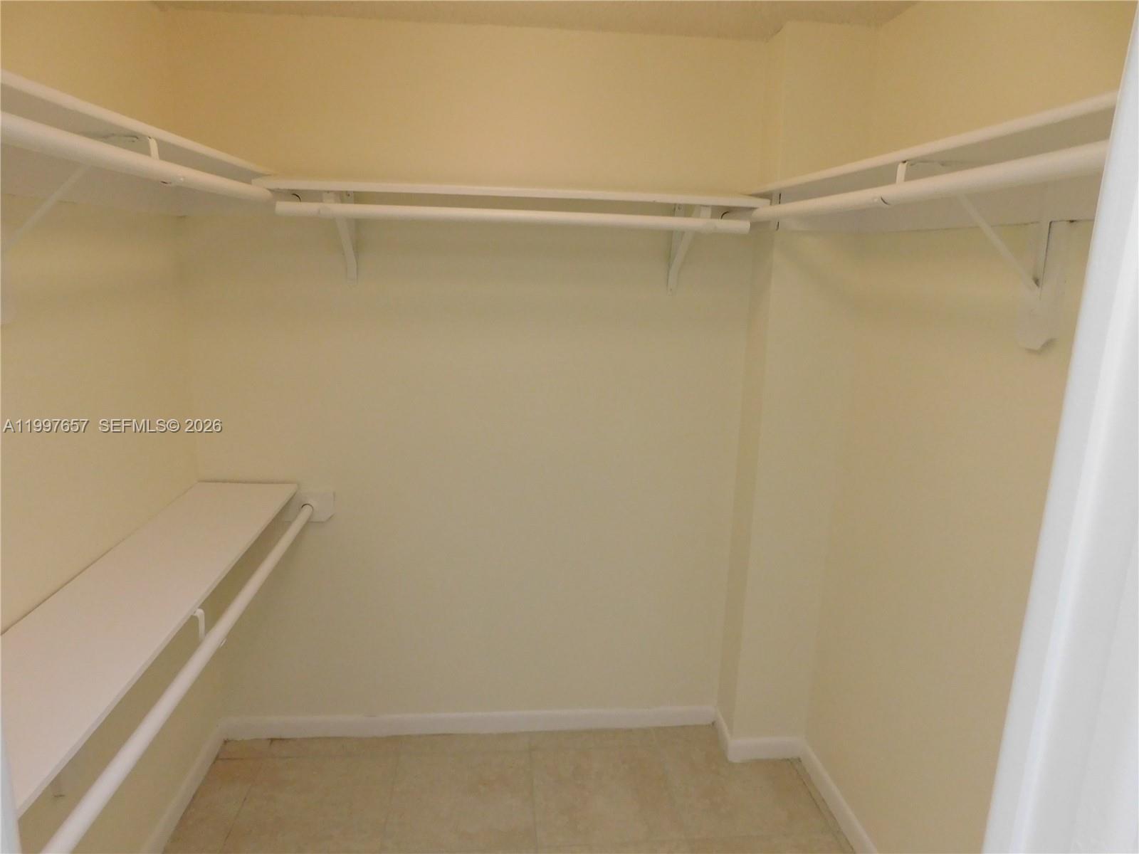 8065 Southwest 107th Avenue, Unit 321 Miami, FL 33173 - Photo 13 of 19 a view of an empty walk in closet
