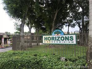 8065 Southwest 107th Avenue, Unit 321 Miami, FL 33173 - Photo 3 of 19 a view of sign board with a house and trees