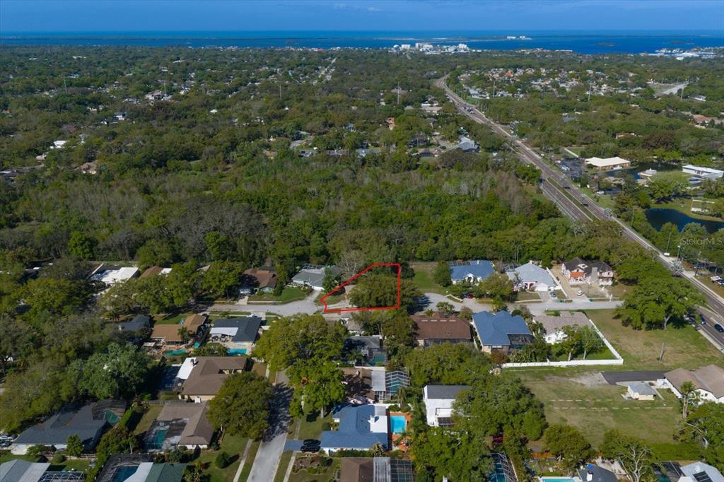 1967 Castille Drive Dunedin, FL 34698 - Photo 7 of 10 an aerial view of a city with lots of residential buildings