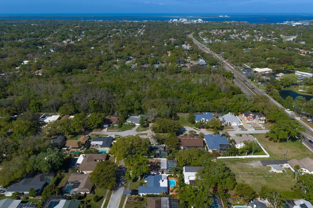 1967 Castille Drive Dunedin, FL 34698 - Photo 8 of 10 an aerial view of a city with lots of residential buildings