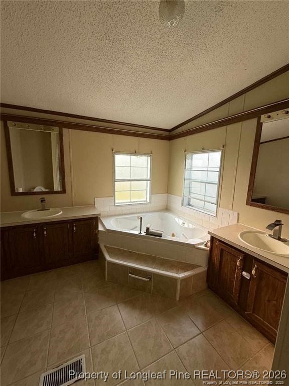 21040 McLaughlin Road Laurinburg, NC 28352 - Photo 13 of 14 a spacious bathroom with a bathtub and a sink