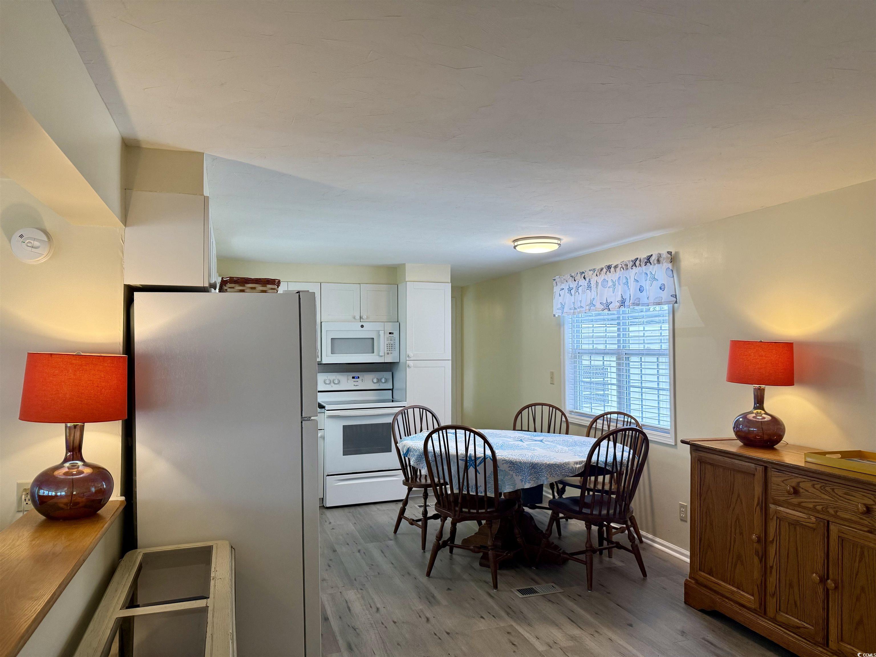 2057 Dipper Surfside Beach, SC 29575 - Photo 12 of 29 Dining room featuring light wood finished floors and baseboards