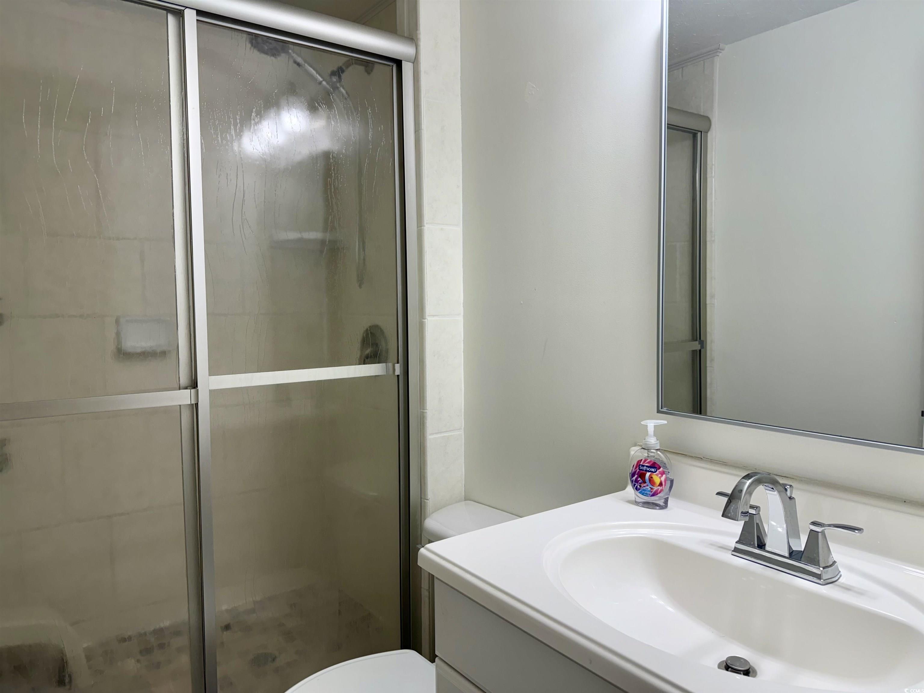 2057 Dipper Surfside Beach, SC 29575 - Photo 14 of 29 Full bathroom with vanity and a shower stall