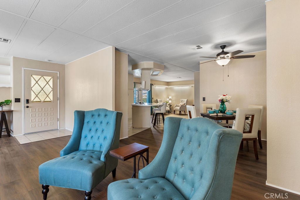 13393 Mariposa Road, Unit 99 Victorville, CA 92395 - Photo 11 of 50 a living room with furniture and a window