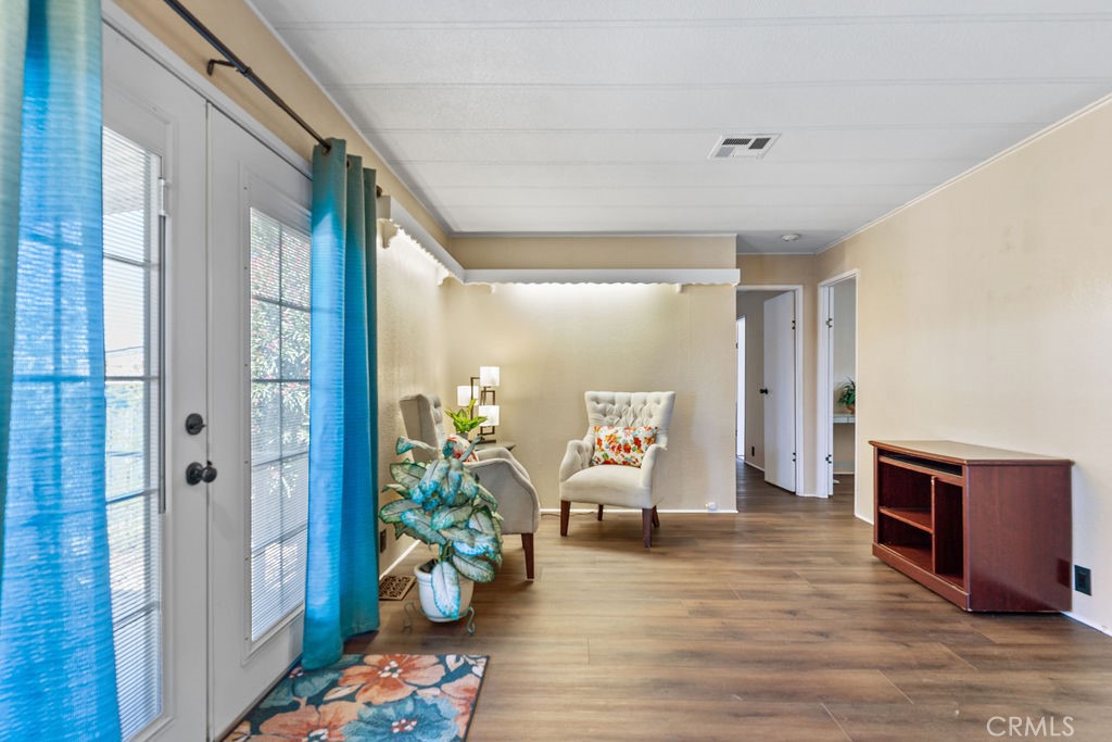 13393 Mariposa Road, Unit 99 Victorville, CA 92395 - Photo 24 of 50 a living room with furniture and a potted plant