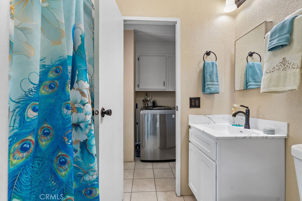 13393 Mariposa Road, Unit 99 Victorville, CA 92395 - Photo 30 of 50 a bathroom with a sink and a mirror