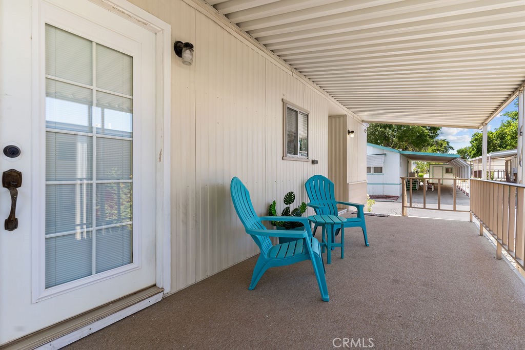 13393 Mariposa Road, Unit 99 Victorville, CA 92395 - Photo 46 of 50 a view of a house with backyard and sitting area