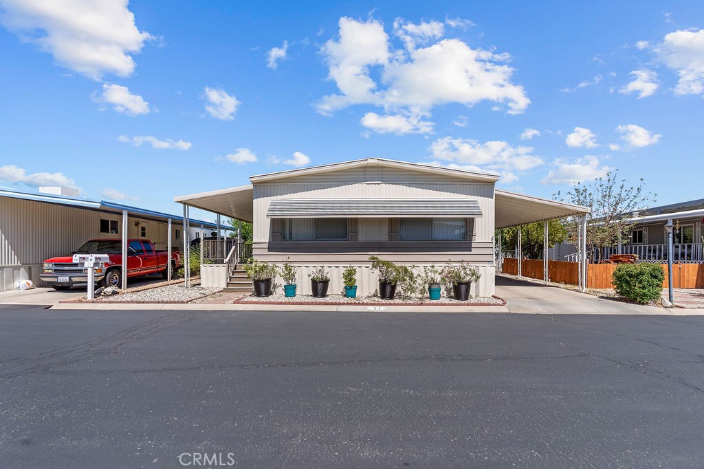 13393 Mariposa Road, Unit 99 Victorville, CA 92395 - Photo 47 of 50 a view of a building with sitting area
