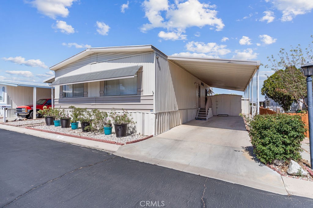 13393 Mariposa Road, Unit 99 Victorville, CA 92395 - Photo 49 of 50 a house view with a outdoor space