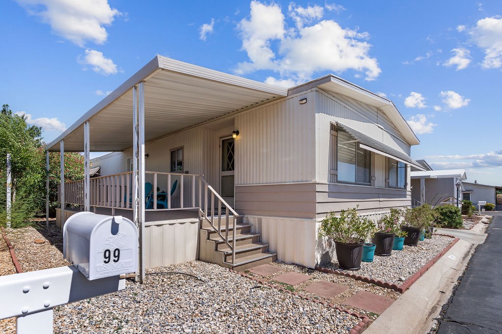 13393 Mariposa Road, Unit 99 Victorville, CA 92395 - Photo 50 of 50 a view of a house with a potted plant