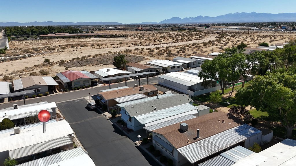 13393 Mariposa Road, Unit 99 Victorville, CA 92395 - Photo 6 of 50 an aerial view of a house with a lake view