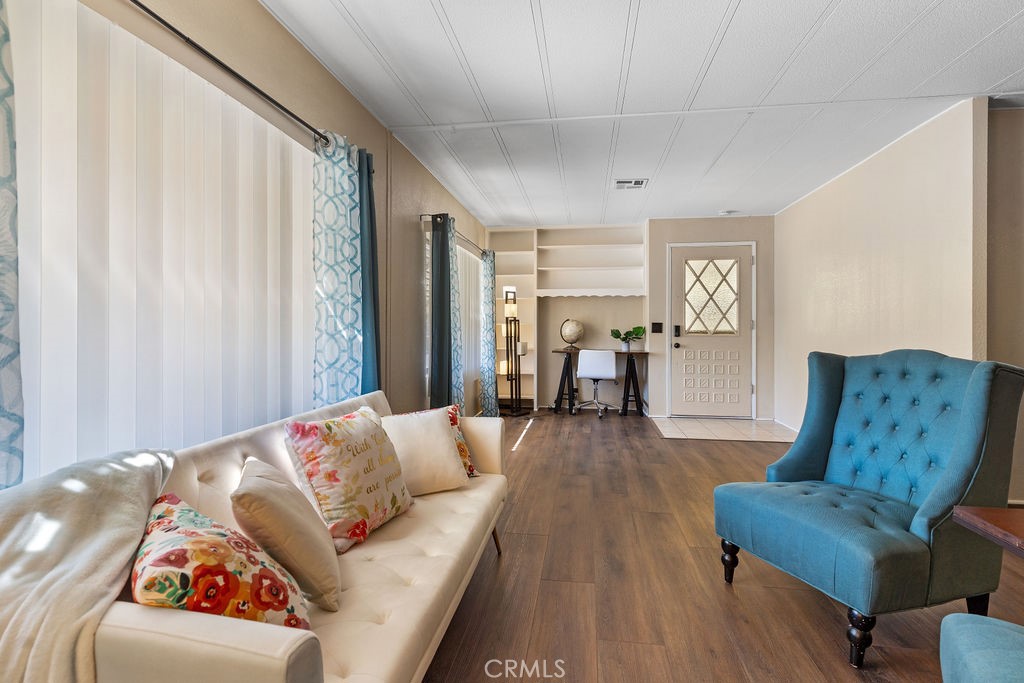 13393 Mariposa Road, Unit 99 Victorville, CA 92395 - Photo 10 of 50 a living room with furniture and a couch
