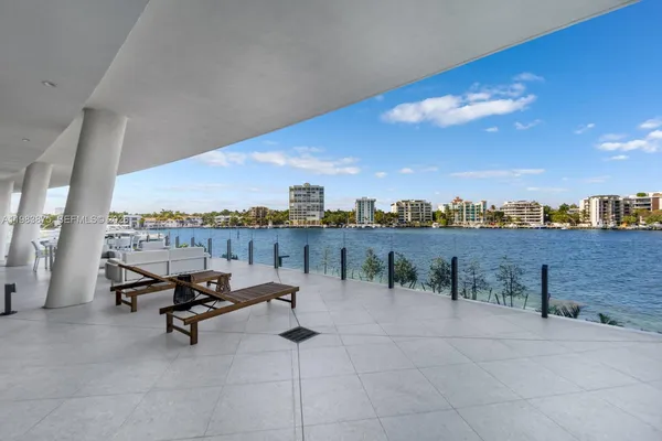a view of a terrace with outdoor seating and city view