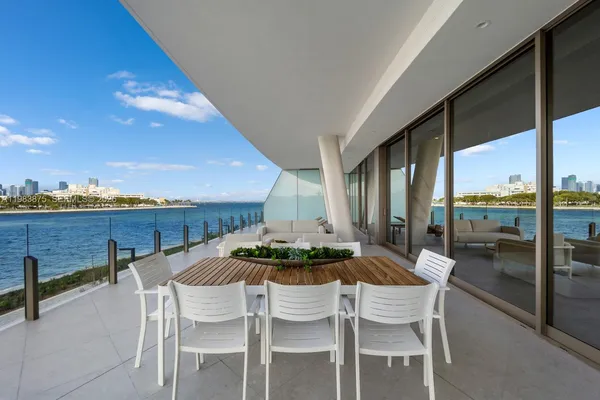 a view of roof deck with furniture