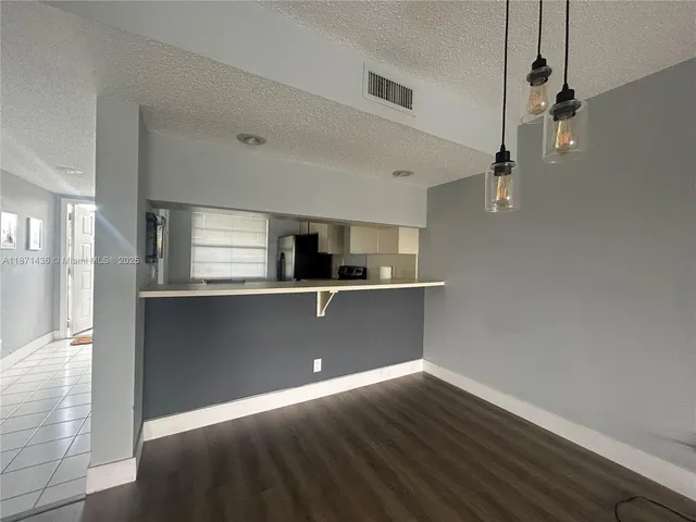 a view of kitchen with window and wooden floor