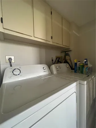 a close view of sink and cabinets