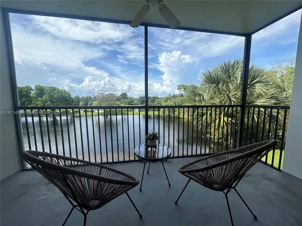 a view of a balcony with wooden floor