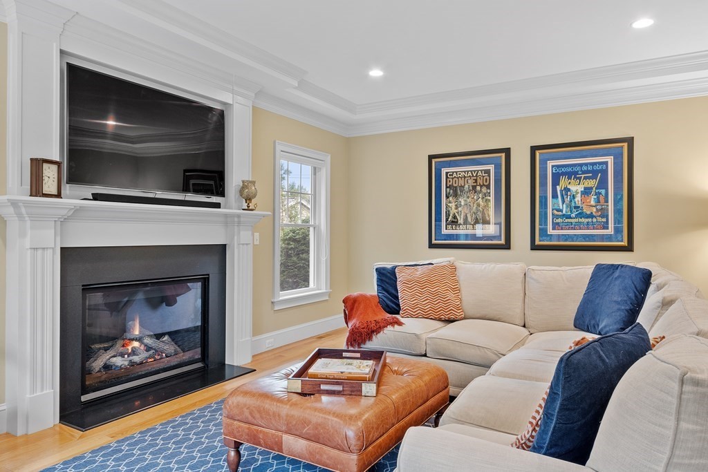 10 Parker Road Bedford, MA 01730 - Photo 18 of 38 a living room with furniture and a fireplace