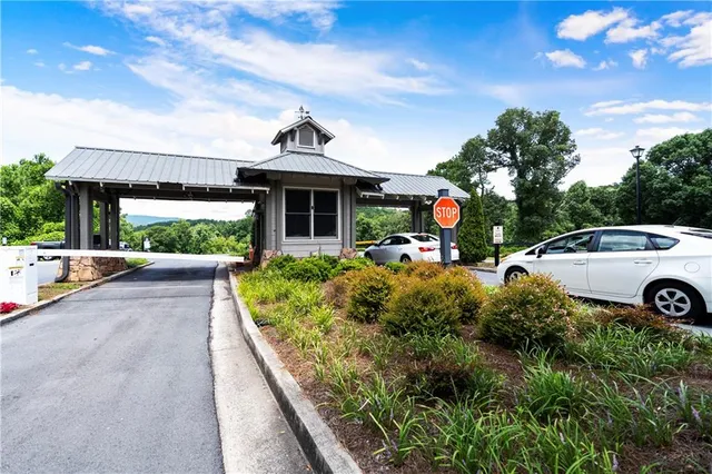 a front view of a house with a yard and outdoor seating