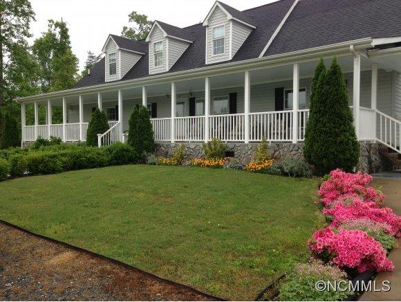 1585 Gilmer Edwards Road Rutherfordton, NC 28139 - Photo 1 of 23 a front view of a house with a yard and potted plants