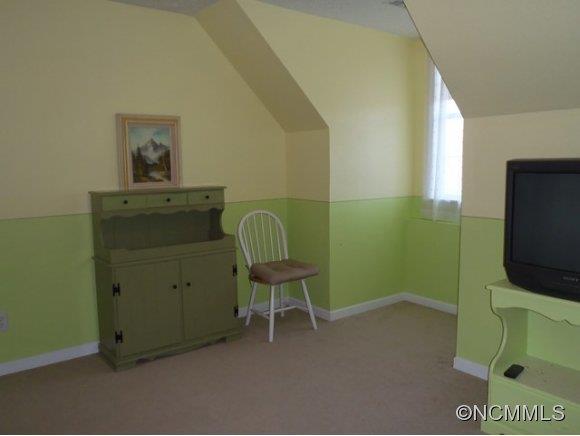 1585 Gilmer Edwards Road Rutherfordton, NC 28139 - Photo 20 of 23 a room with a chair and a flat screen tv