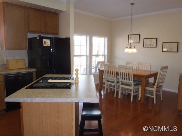 1585 Gilmer Edwards Road Rutherfordton, NC 28139 - Photo 4 of 23 a kitchen with a table chairs and a dining table