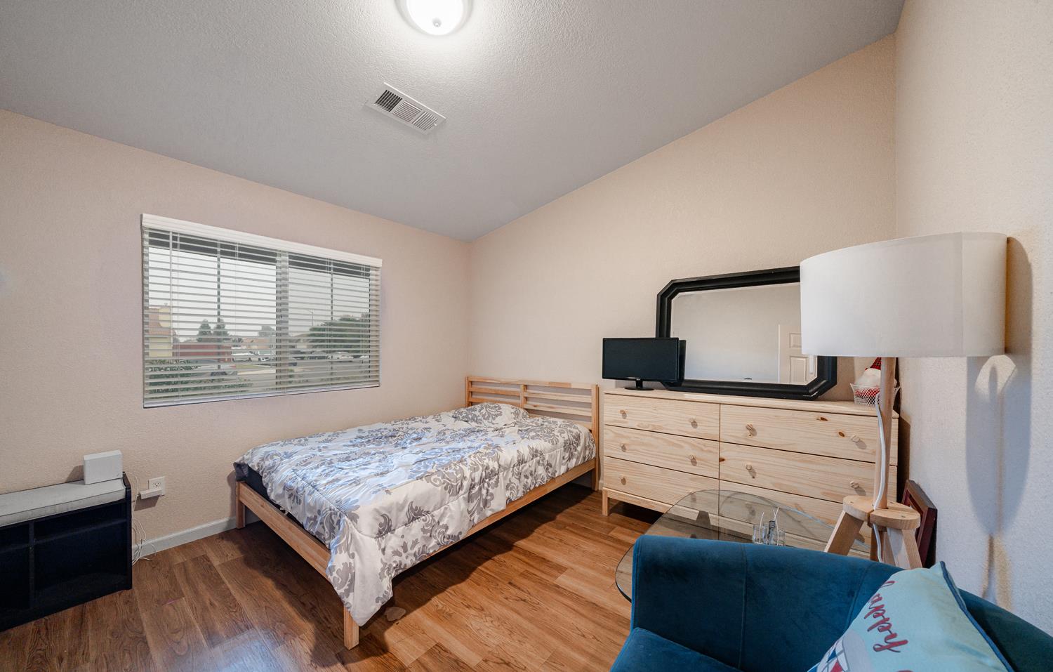 1935 Madison Drive Madera, CA 93638 - Photo 14 of 22 a bedroom with a bed and a window