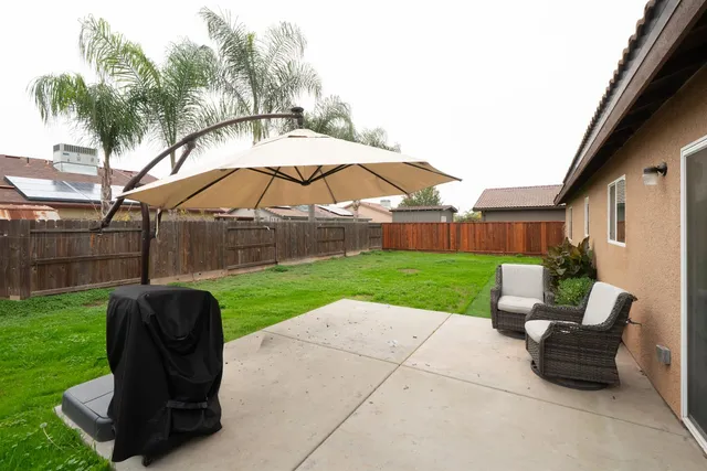 a view of a garden with furniture