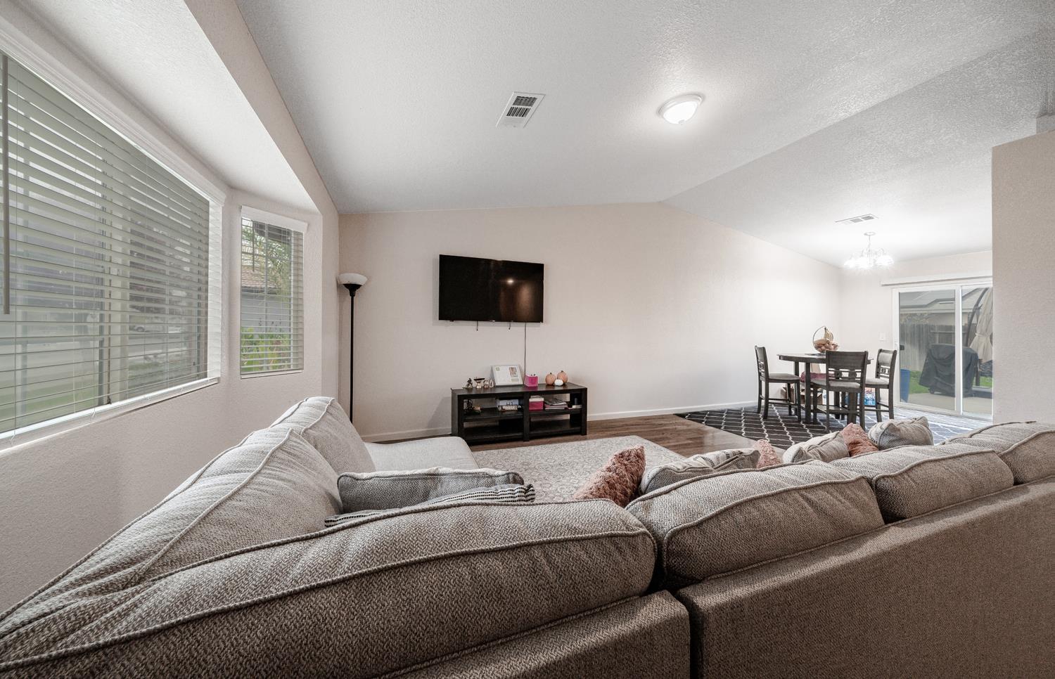 1935 Madison Drive Madera, CA 93638 - Photo 5 of 22 a living room with furniture and a flat screen tv