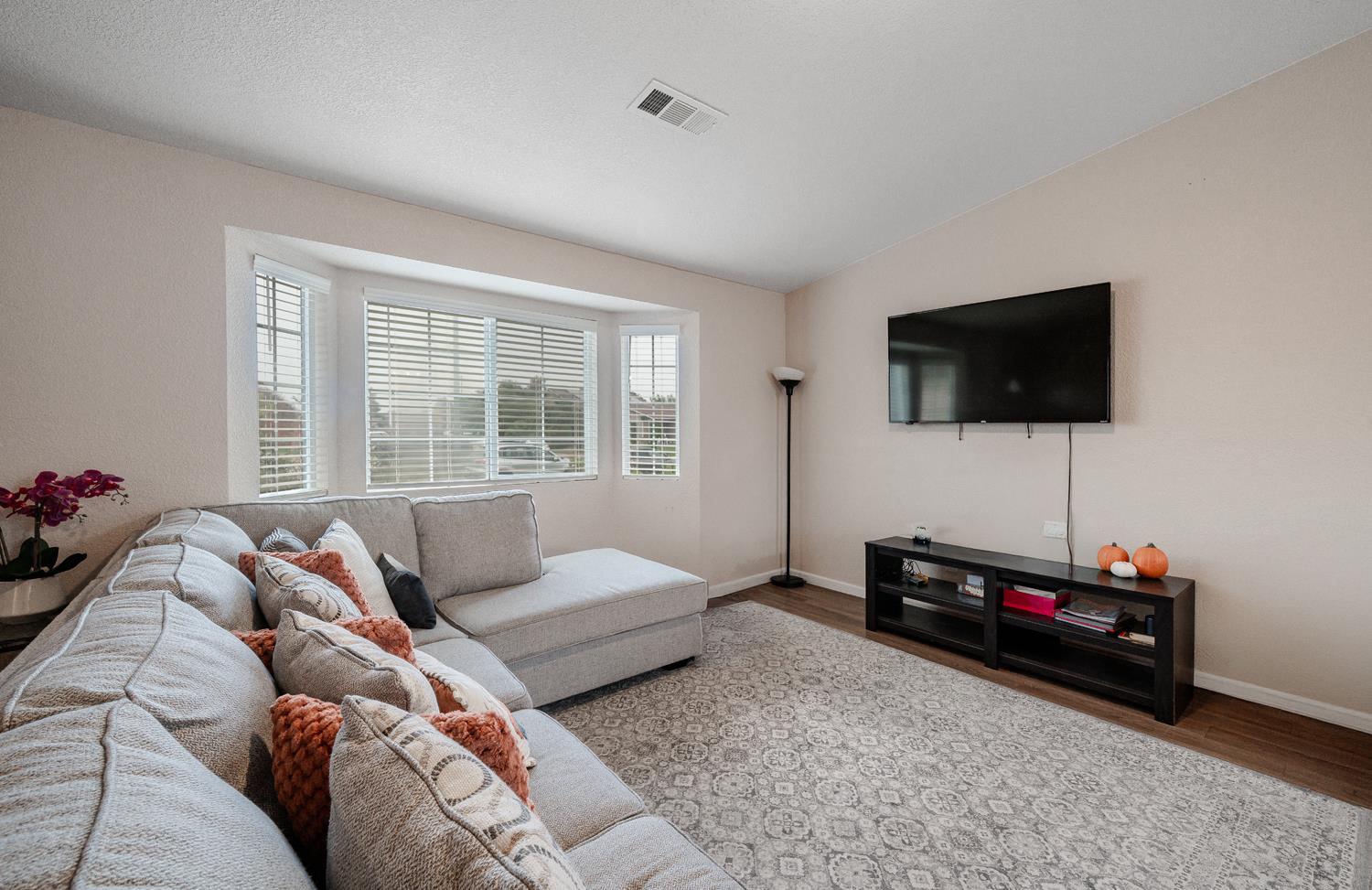 1935 Madison Drive Madera, CA 93638 - Photo 7 of 22 a living room with furniture and a flat screen tv