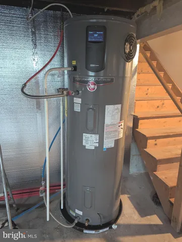 a view of a house with a yard covered in snow