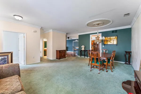 a view of a livingroom with furniture and a flat screen tv