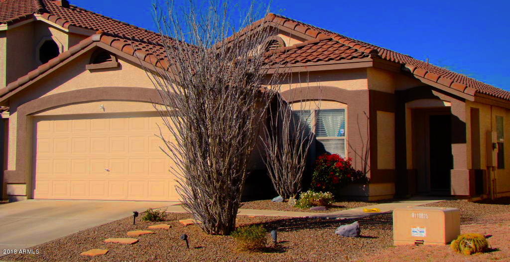 5112 East Peak View Road Cave Creek, AZ 85331 - Photo 1 of 18 a front view of a house with a yard
