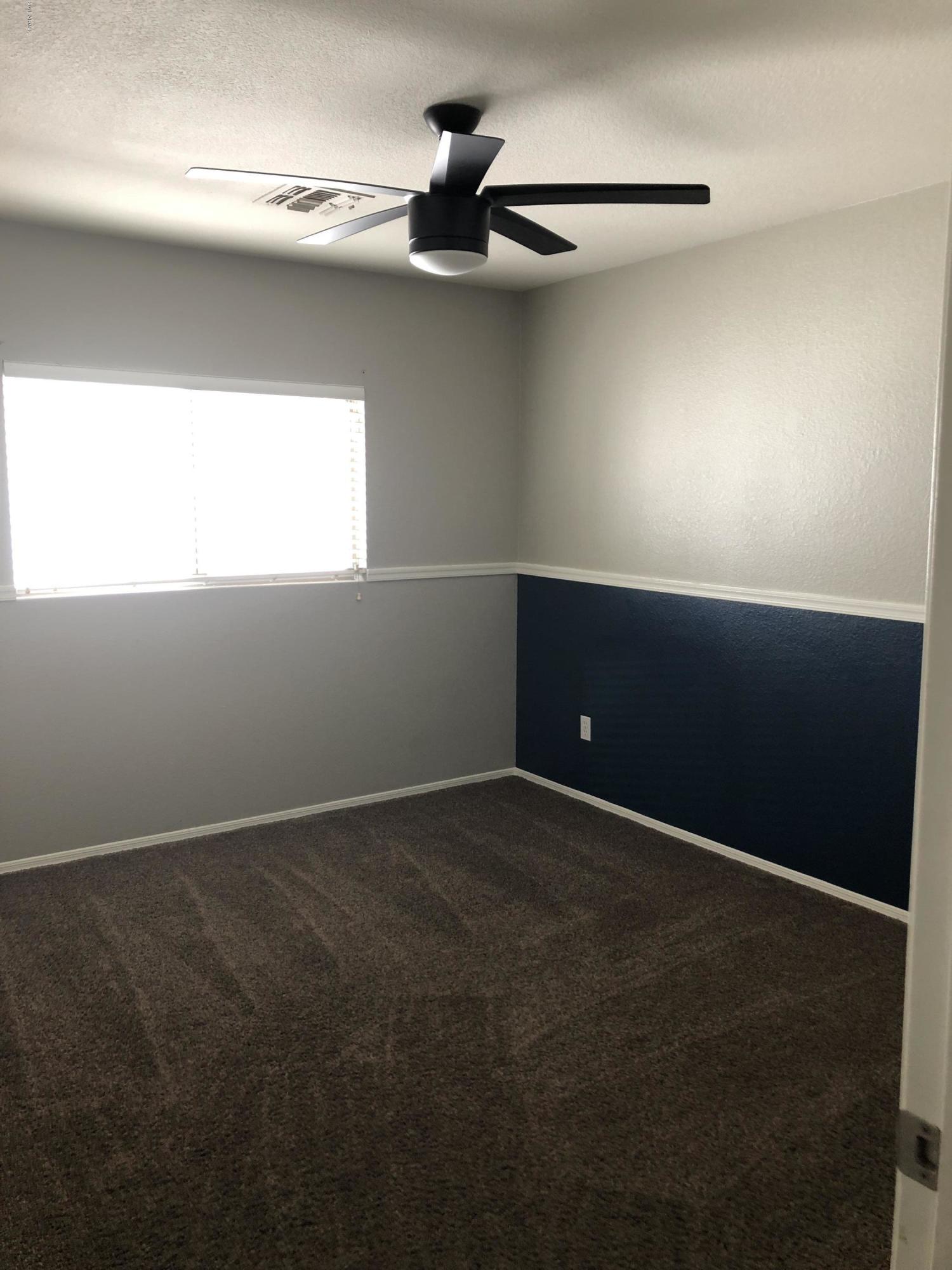5112 East Peak View Road Cave Creek, AZ 85331 - Photo 17 of 18 a view of an empty room and a window