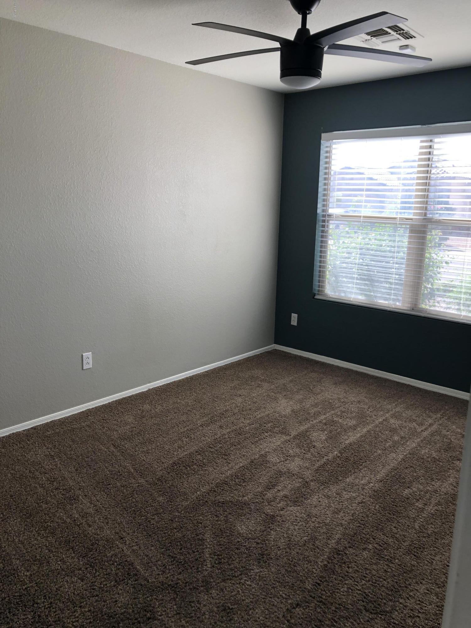 5112 East Peak View Road Cave Creek, AZ 85331 - Photo 18 of 18 a view of an empty room with a window