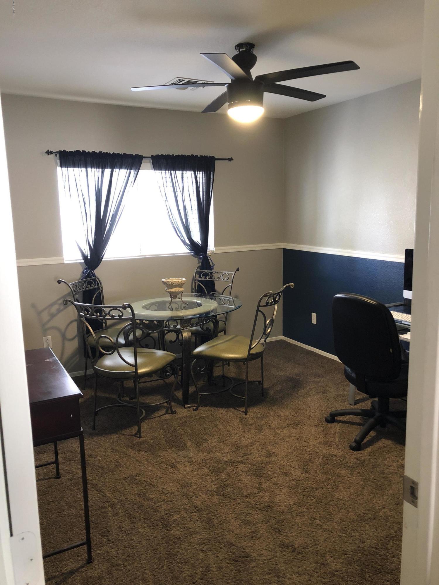 5112 East Peak View Road Cave Creek, AZ 85331 - Photo 10 of 18 a workspace with furniture and a window