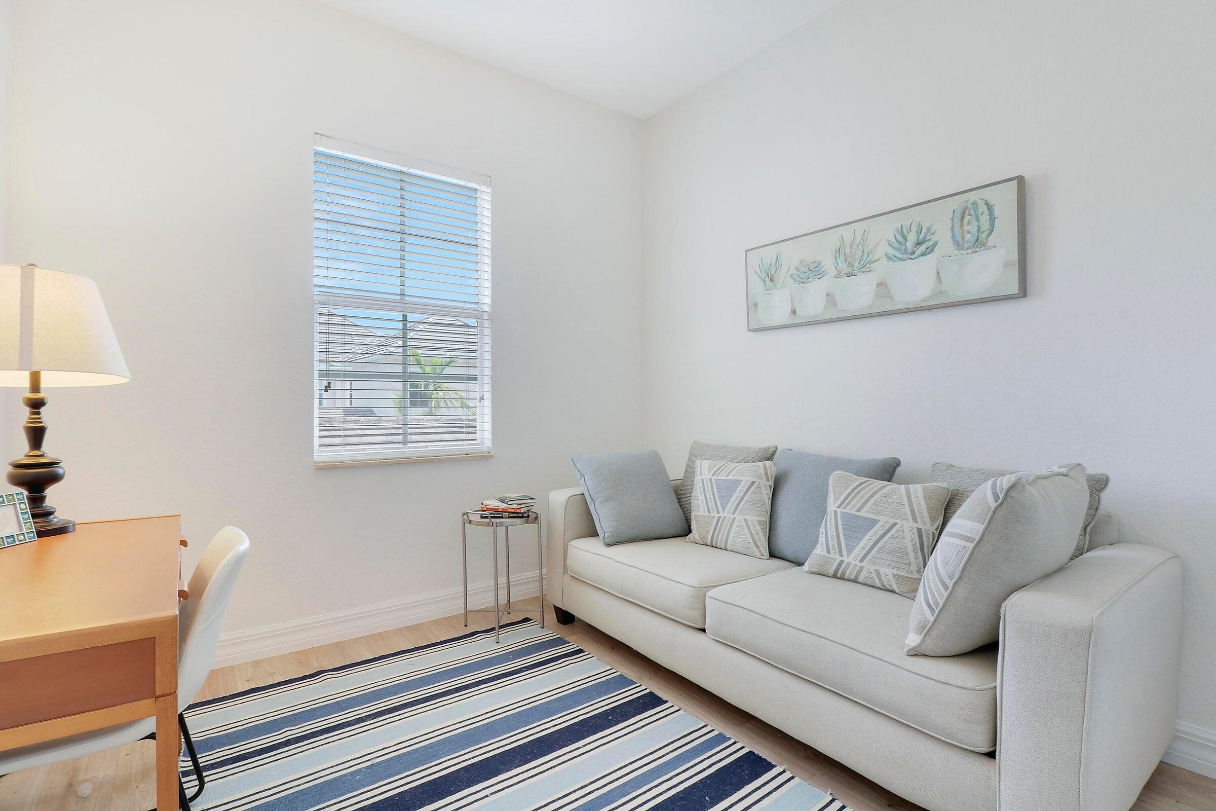 151 Mulligan Place Jupiter, FL 33458 - Photo 15 of 23 a living room with furniture and a window