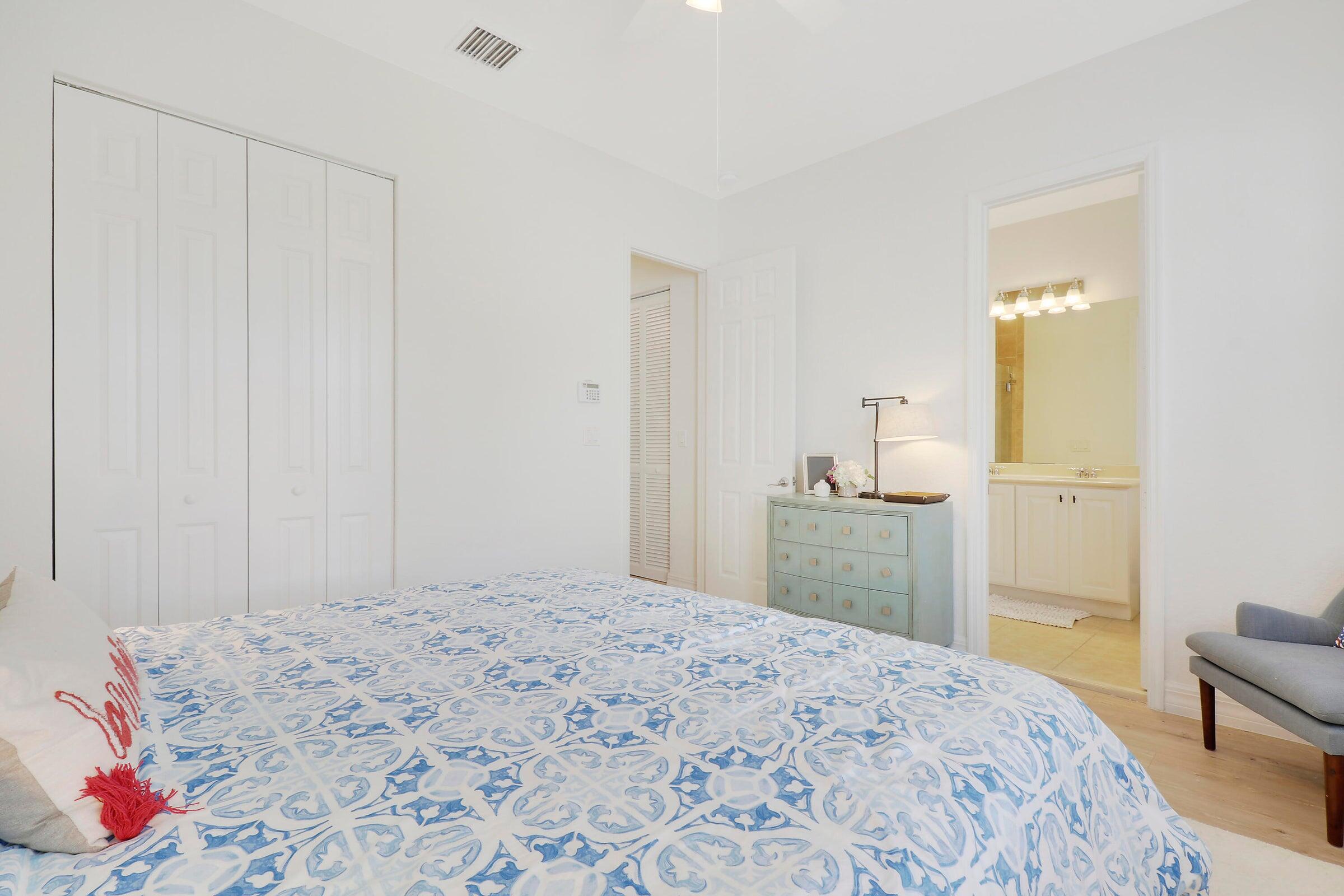 151 Mulligan Place Jupiter, FL 33458 - Photo 19 of 23 a bedroom with a bed and a sink