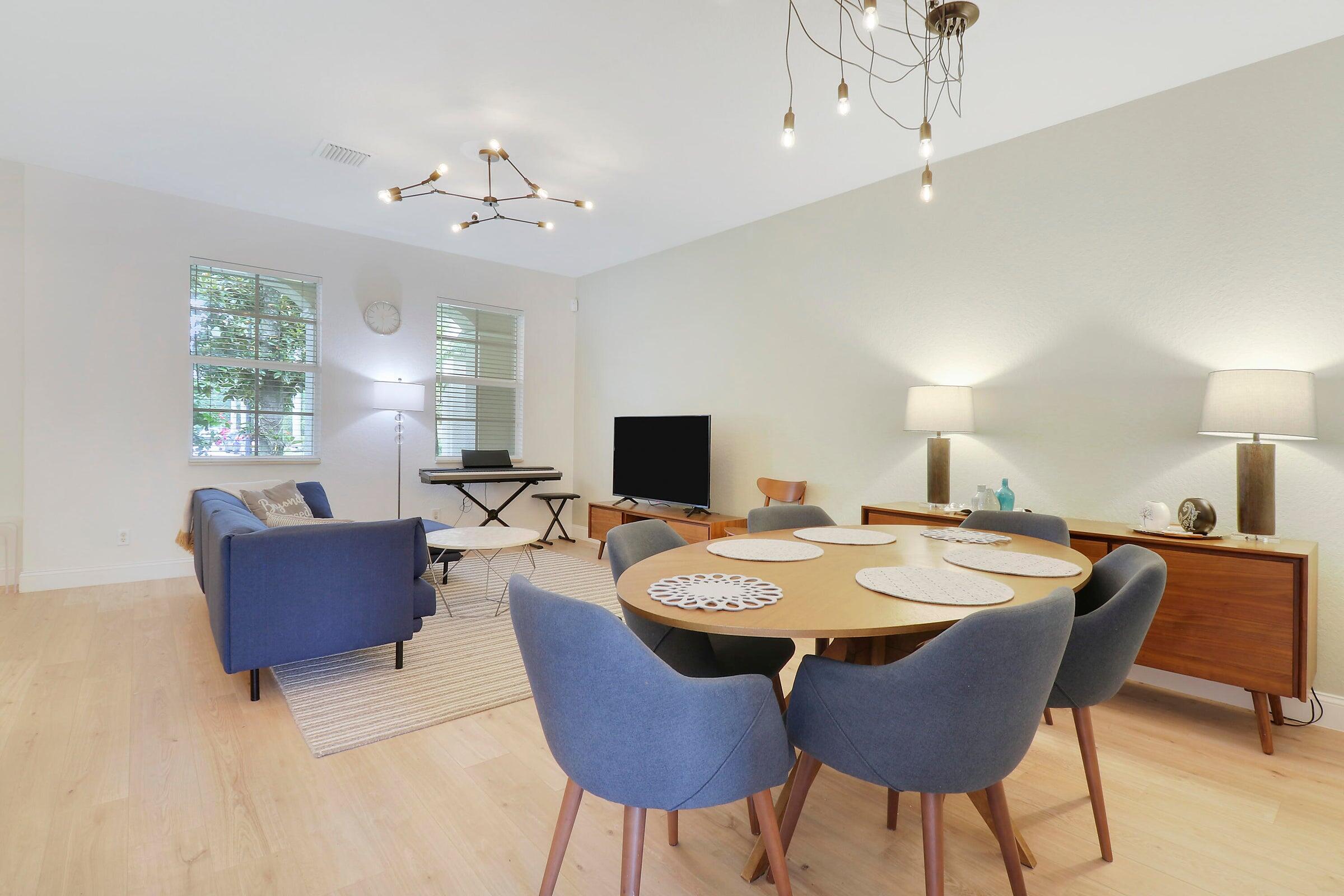 151 Mulligan Place Jupiter, FL 33458 - Photo 5 of 23 a view of a dining room with furniture