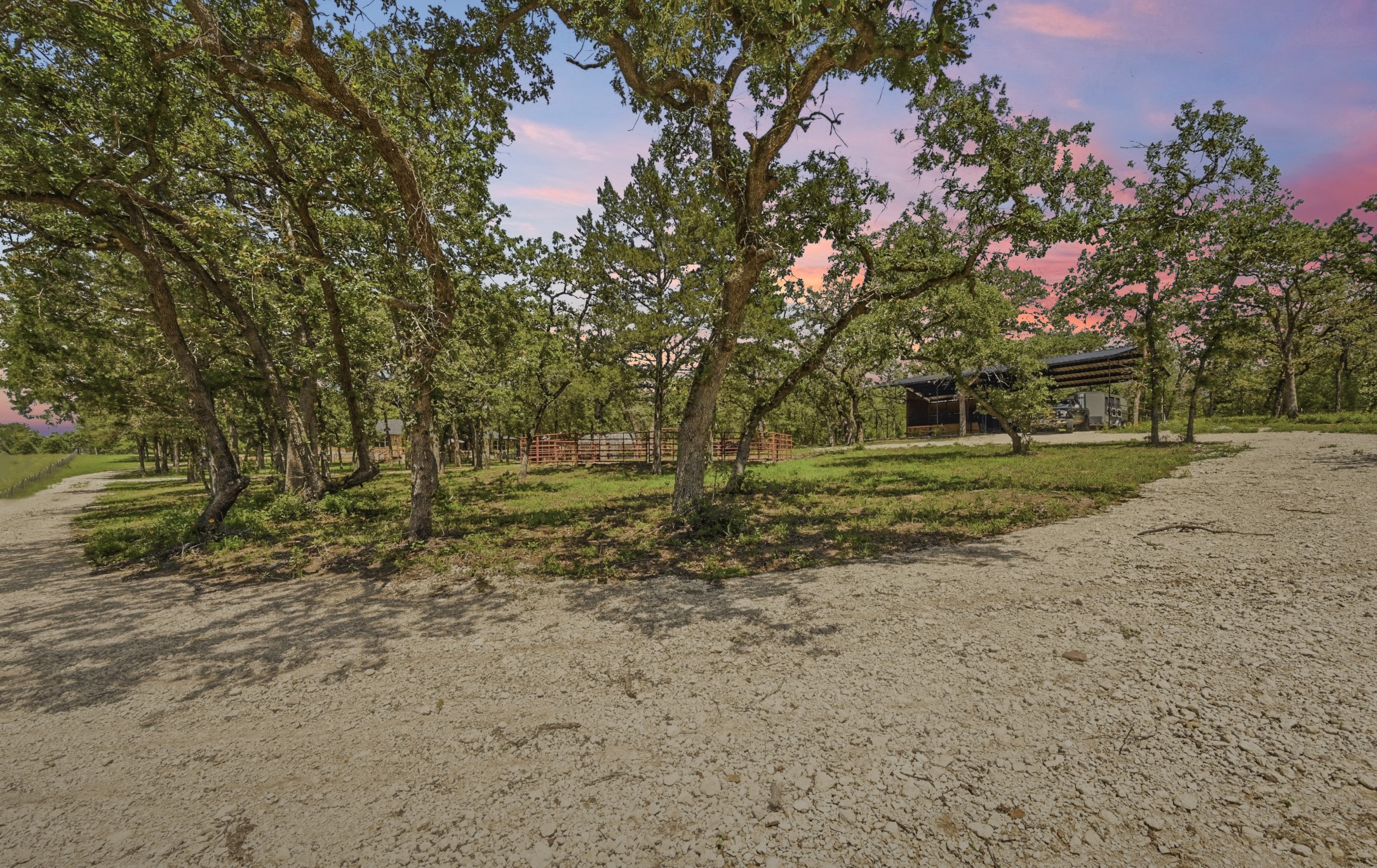 387 Corral Road Smithville, TX 78957 - Photo 38 of 40 Gravel drive with mature trees