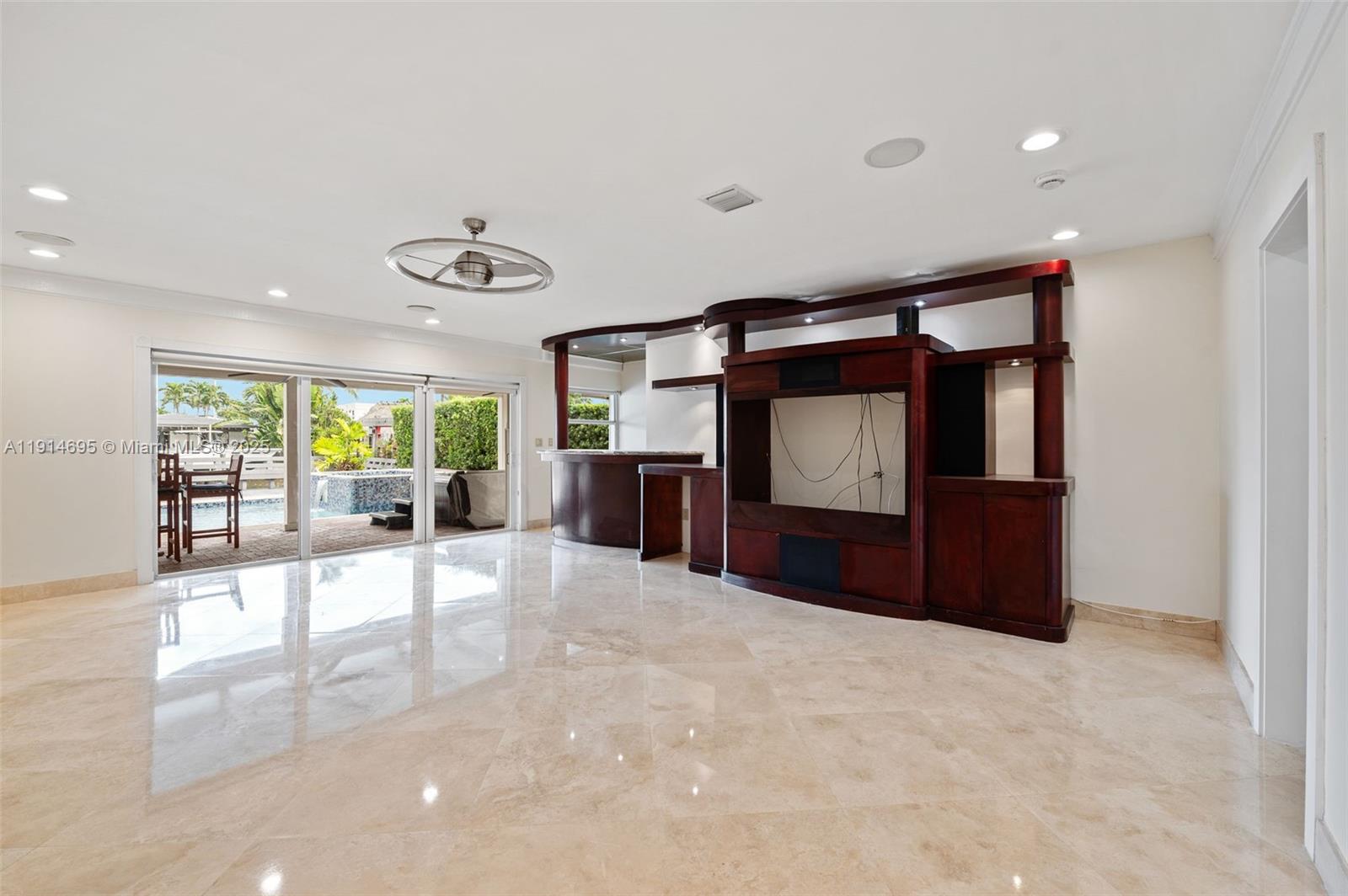 2015 Northeast 120th Road North Miami, FL 33181 - Photo 25 of 67 a view of a hallway with a flat screen tv
