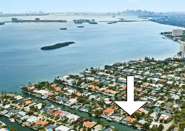 a kitchen with granite countertop a stove and cabinets